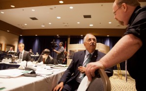 NWT MP Dennis Bevintongton and his legislative assistant Doug Johnson chat before the afternoon session, with committee chair Chris Warkentin behind.