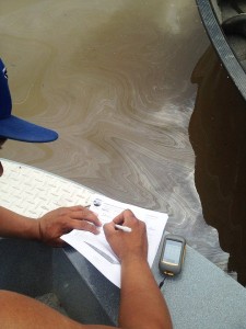Athabasca Chipewyan First Nation take water samples after finding a possible oil spill on the Athabasca River on the weekend.