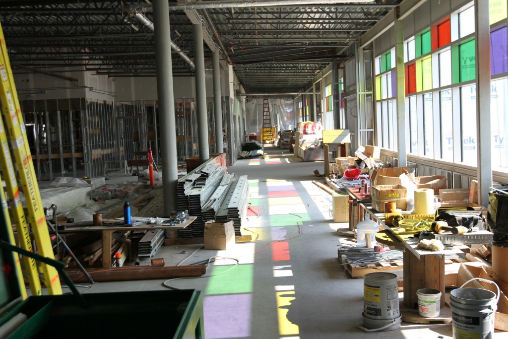 A peek at the interior of the new Hay River health centre shows a spacious lobby lit up by coloured glass.