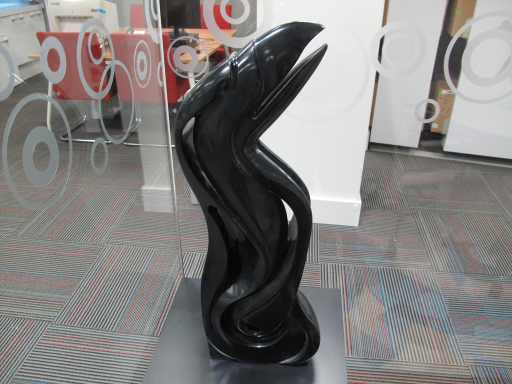 Dene artist John Sabourin’s raven carving, made of black chlorite from British Columbia, stands 66 cm tall in the NWT boardroom at Canada House.