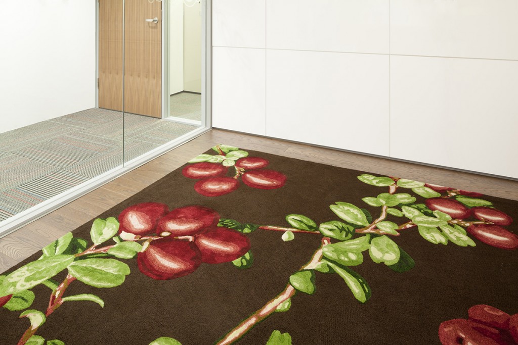 Fort Smith artist Brandy Wilson’s lowbush cranberry photograph, top, was made into a carpet for the NWT boardroom at Canada House in London, England.