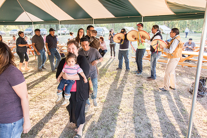 Bev Chepelsky and her daughter Yevah lead a line of drum dancers.