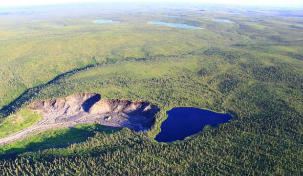 Looking northeast at a permafrost thaw slump and small lake that is expected to drain catastrophically causing flash flooding near Husky Lake, Gwich’in Settlement Area.