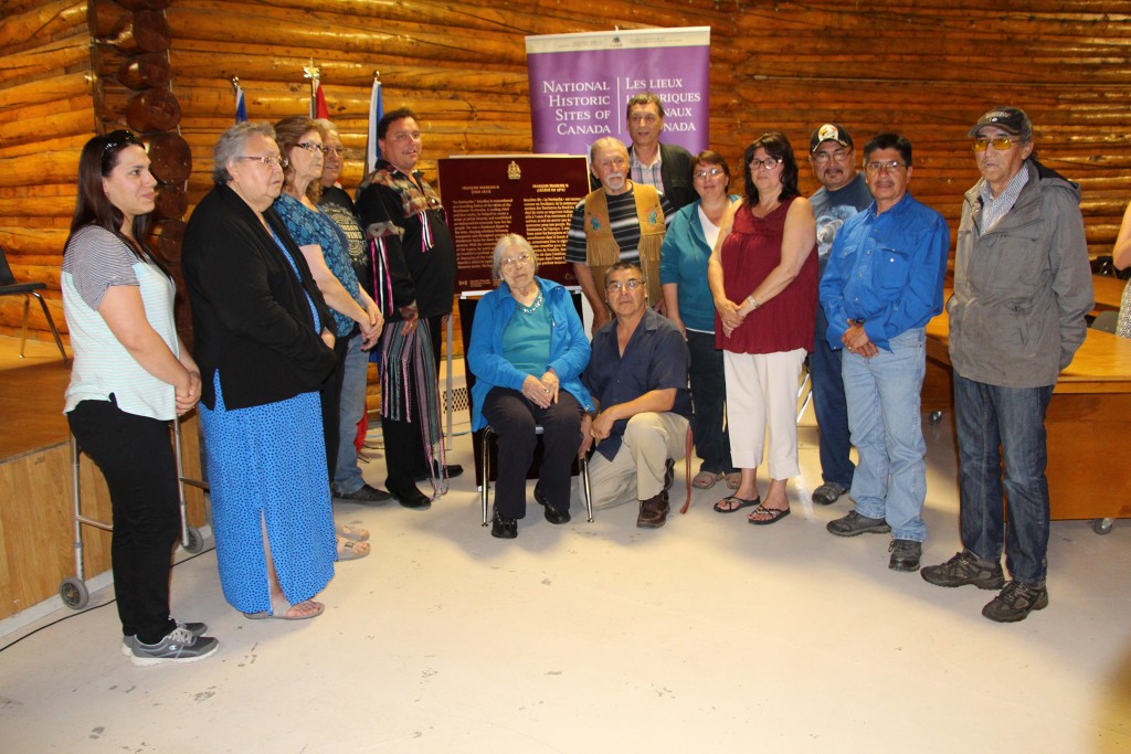 Descendants of Francois Beaulieu II gather around the plaque honouring him as a person of national historic significance.