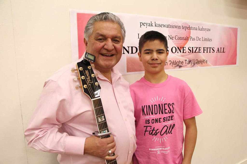 NWT Commissioner George Tuccaro and rapper Jomei Newkirk, who performed his own anti-bullying piece shared a stage at Pink Shirt Day assembly at JBT Elementary School in Fort Smith on Feb. 23. (Please see video)