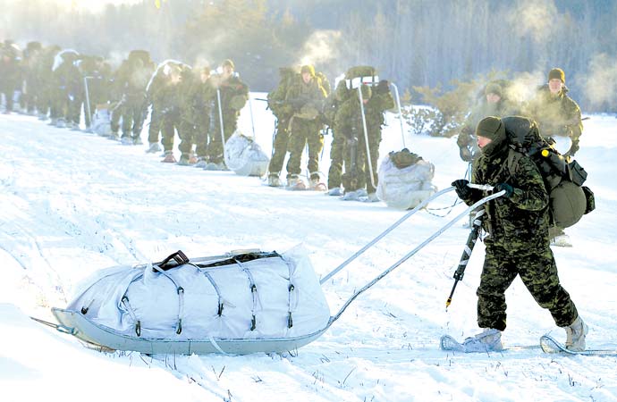 Distributing army supplies via sleigh and snowshoes is a practical way to overcome northern weather conditions.